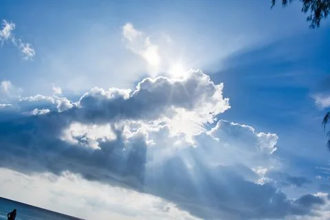 Rays effect of sun behind clouds Stock Photos