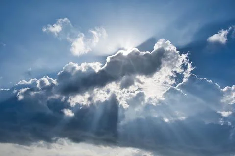 Rays effect of sun behind clouds Stock Photos