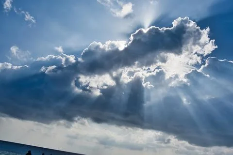 Rays effect of sun behind clouds Stock Photos