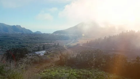 Rays of the evening sun breaking through the clouds and fog to the meadow of Video stock 120405194