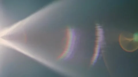 Rays with flares emerge from the edge of the frame and move on black background Stock Footage 313154549