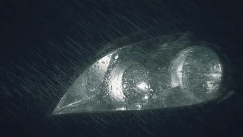 In the rays of headlight light of car are raindrops and fine water suspension  Stock Footage 138294384