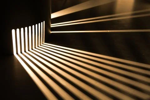 Rays of light are refracted on a black background. Background with a place .. Stock Photos