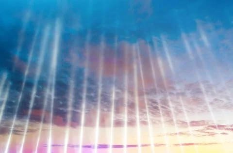 Rays of light from an artificial light source pointing up into the sky at the Foto stock