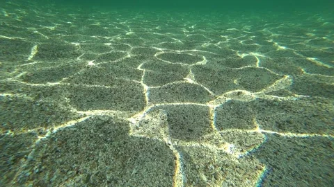 Rays of light  on the bottom of the sea Video stock 165893910