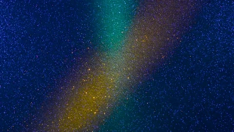 Rays of light of different colors flash on a shiny background Stock Footage 195700788