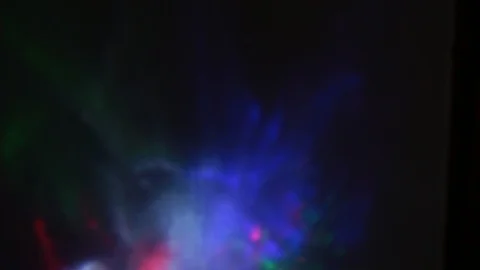 Rays of light of different colors sparkle on the edges of a crystal vase Stock Footage 107469751