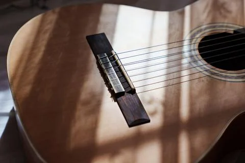 Rays of light on the guitar. Stock Photos