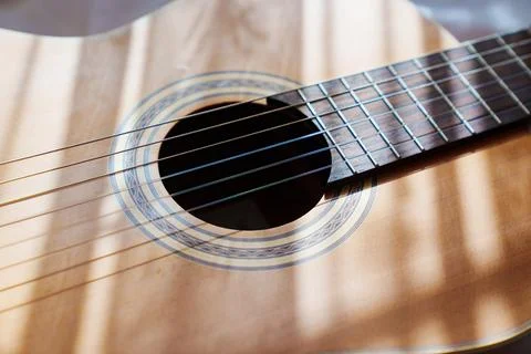 Rays of light on the guitar. Stock Photos