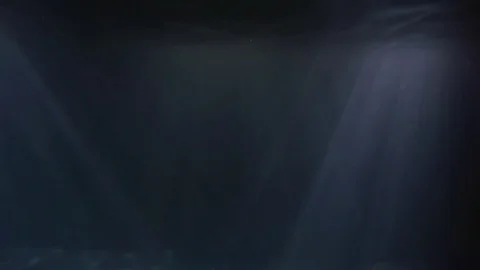 Rays of light make their way through the dark water Video stock 105121566