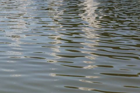 Rays of light making their way on the water Stock Photos