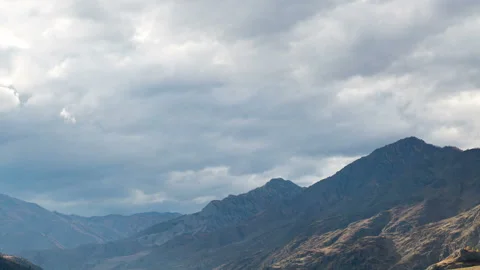 Rays of light in the misty mountains.Rays of light breaking through the cloudy s Stock Footage 199486355