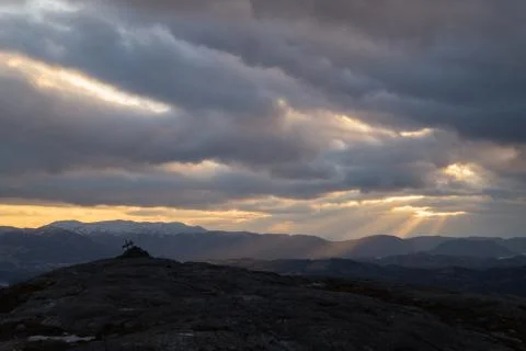 Rays of light from mountain top with a sign on Stock Photos