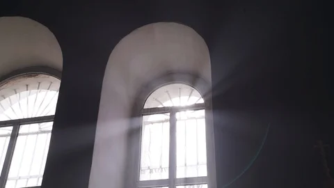 Rays of light pass through a window in church Stock Footage 105343502