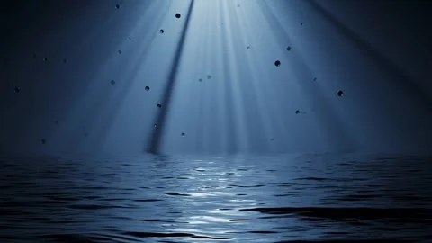 Rays of light shine and move across the surface of the sea at night. Video stock 335244421