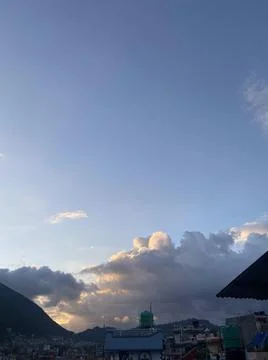 Rays of Light Shining Down Pass Clouds and Sky Stock Photos