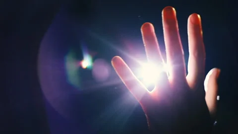 Rays Of The Light Through His Fingers Palm Light On Hand, magic and dark force Stock Footage 140451754