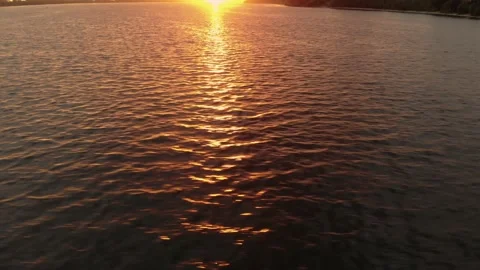 Rays of the outgoing sun are reflected in the water Stock Footage 142350413