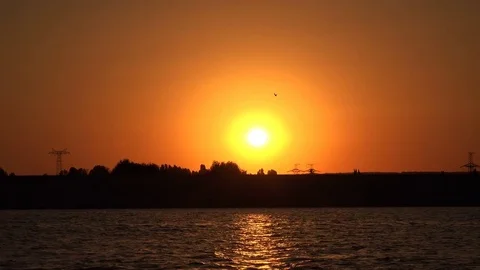 Rays of the outgoing sun on the surface of the river Stock Footage 85366287