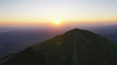 Rays of the rising sun above Rtanj mountain peak Stock Footage 247968387