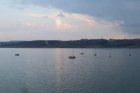 The rays of the setting sun on the lake Stock Photos