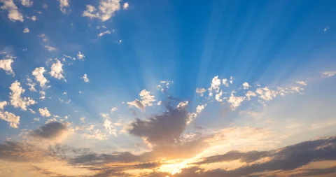 Rays of the setting sun make their way through the clouds across the horizon Stock Footage 94758102