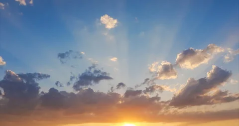 Rays of the setting sun make their way through the clouds Stock Footage 94758200