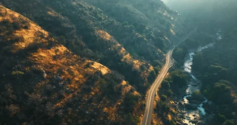 Rays of setting sun pass to the rocks of California desert.  Stock Footage 250437407