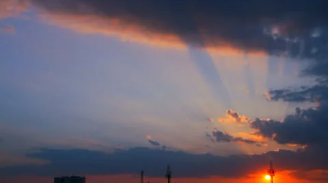 Rays of the setting sun through the clouds Stock Footage 30298764
