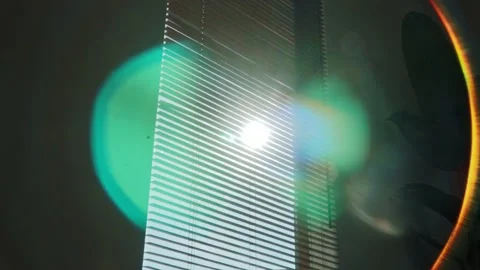 Rays of setting sun through the roller blinds on window, Sunshine over the Video stock 148453245