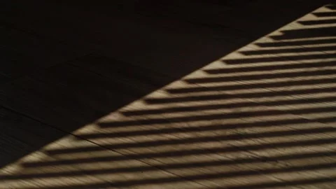 Rays of setting sun through the roller blinds on window, Sunshine over the 스톡 동영상 148453253