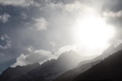 Rays of the sun above the mountains Stock Photos