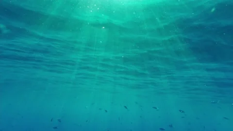 Rays of the sun in blue sea water Stock Footage 166487355