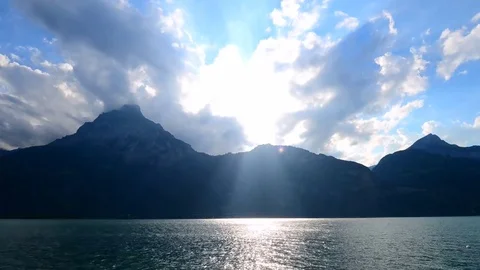 The rays of the sun in the clouds. Mountain Lake. Stock Footage 74183422