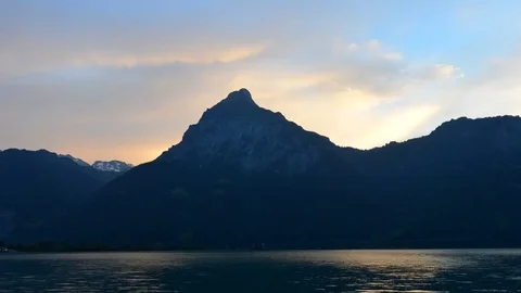 The rays of the sun in the clouds. Mountain Lake. Stock Footage 74183497