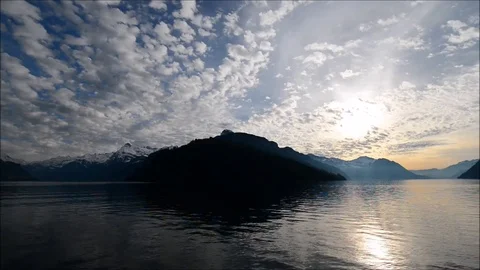 The rays of the sun in the clouds. Mountain Lake. Stock Footage 74183592