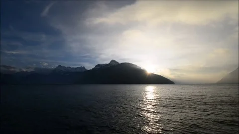 The rays of the sun in the clouds. Mountain Lake. Stock Footage 74183604