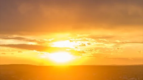 Rays of the sun in the clouds at sunset over the village Video stock 109514384