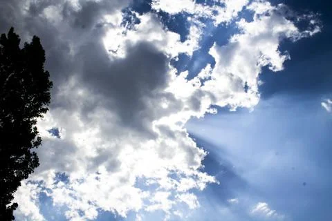 Rays of the sun coming out of the clouds Stock Photos