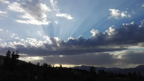 The Rays sun entrenching through clouds. Stock Photos