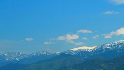 The Rays Of The Sun Fall On Part Of The Clouds. Mountain In The Distance Is Fotos Stock