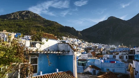 The rays of the sun illuminates the blue city Chefchaouen, Morocco Stock Footage 98816069
