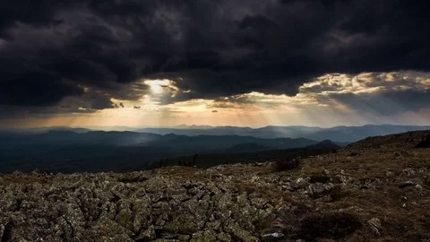 Rays of sun light through rain storm clouds with high contrast Stock Footage 81333383