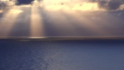Rays of the sun lighting up the surface of the sea 스톡 동영상 122239530