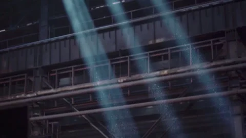 The rays of the sun make their way into the workshop of a metallurgical plant Stock Footage 247741088