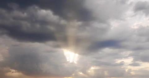 Rays of the sun making their way through thunderclouds Stock Footage 91658931
