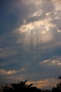 Rays of the sun penetrating through the clouds Stock Photos