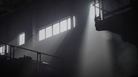 The rays of the sun shine into the workshop of a metallurgical plant Stock Footage 172225608