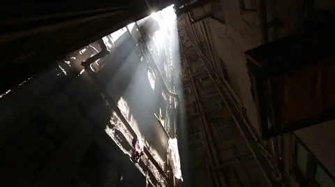 Rays of the sun streaming in ugly urban slums Stock Footage 40717701