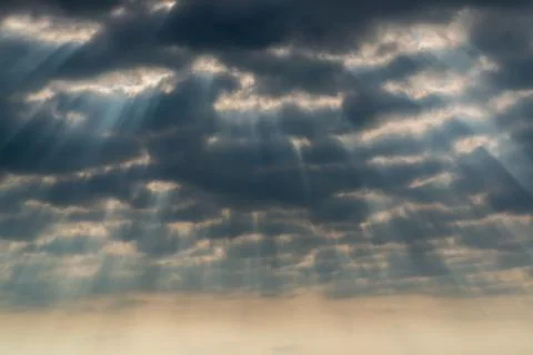 Rays of sun through the clouds Stock Photos